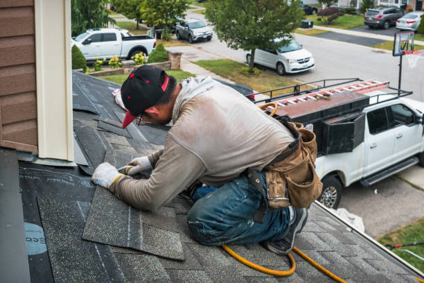 Professional Roofing technician working in Robertsville, NJ